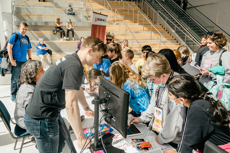 Students gather at a technology leadership event to learn app development